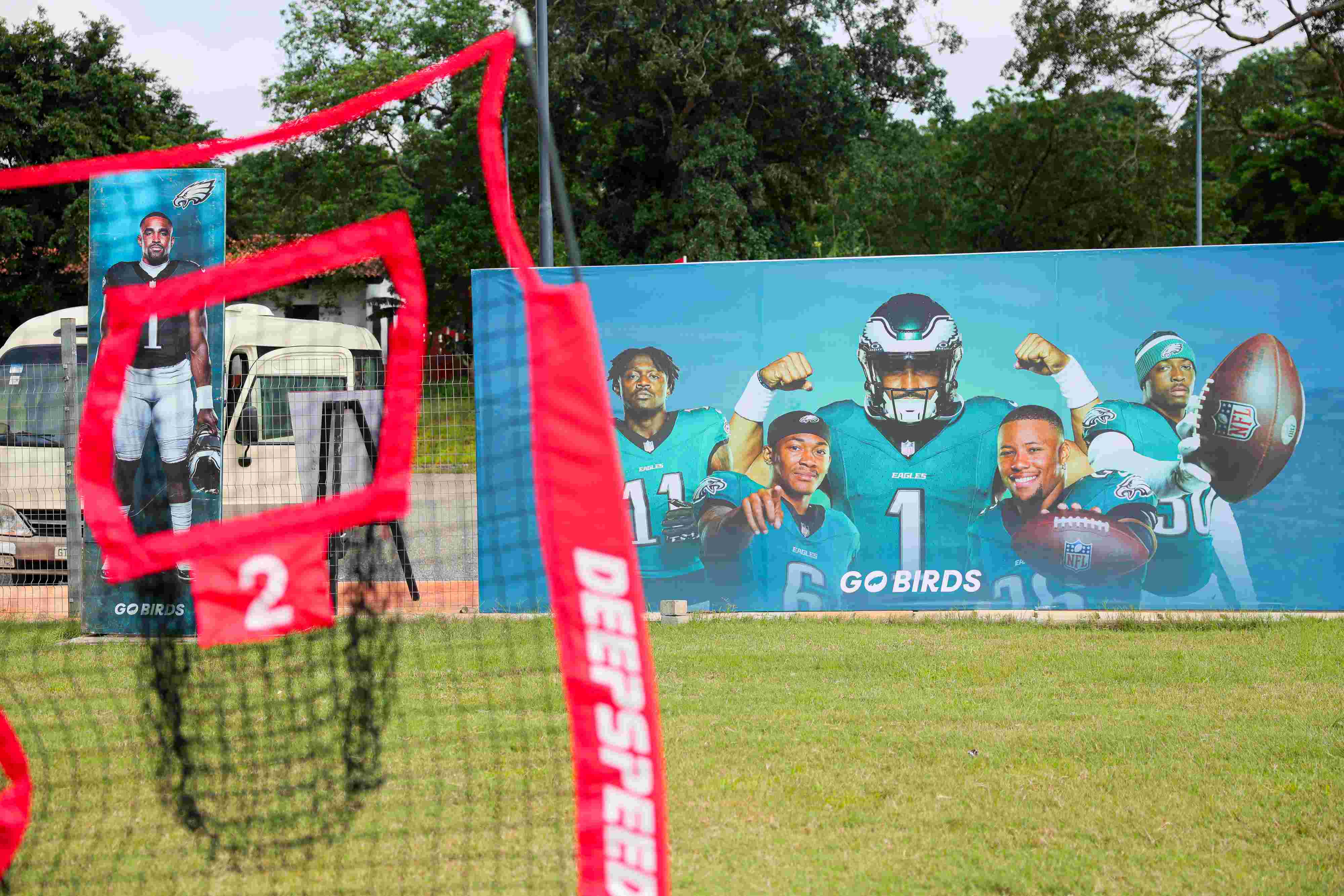 Players running drills at a training camp